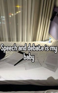 a bed that has papers on it and the words speech and debate is my baby