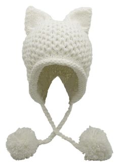 a white knitted cat hat with pom - poms