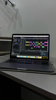 an open laptop computer sitting on top of a desk