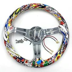 a steering wheel cover with colorful designs on it