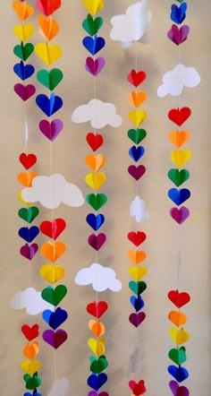 colorful paper hearts and clouds hanging from strings