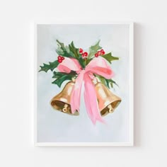 a painting of two bells with holly and pink ribbon on it's front, against a white wall