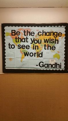 a sign that reads be the change that you wish to see in the world gandhi