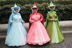 three women dressed in costume standing next to each other