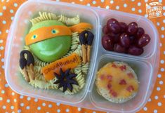 a plastic container filled with food on top of a table