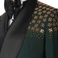 Package Includes: 1 x Jacket - 1 x Pant

Introducing the custom green tuxedo with stone embroidery, crafted from luxurious 120s fabric with a silk lining. This all-season tuxedo features a double-breasted jacket with a shawl lapel, three straight pockets, and stunning stone embroidery on the shoulders. The flat-front trousers include two back pockets and a zip closure, ensuring style and functionality. Perfect for any formal occasion, this tuxedo combines elegance and impeccable craftsmanship.

 	Fabric: 120s 
 	Lining Fabric: Silk
 	Pattern: Plain
 	Buttons: Fabric
 	Construction: Half Canvas
 	Seasonality: All Season
 	Jacket: Shawl Lapel, 3 Straight Pockets, Stone Embroidery on Shoulder, Double Breasted
 	Trouser: Flat front, 2 Back Pockets, Zip Closure Mens Suits Green, Green Jacket Men, Gold Tuxedo, Green Tuxedo, Stone Embroidery, Pearl Embroidery, Three Piece Suit, Double Breasted Jacket, Exclusive Jewelry