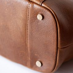 "A seasoned leather for every season of motherhood and womanhood. Tanned and finished with the finest oils and waxes, your bag reacts to your touch to reveal its complex coloring. Our New York leather factory tumbles and finishes each hide using Old World techniques and time-honored traditions. It is the same tumbling process as our deluxe leather but with a natural finish. Welcome to the unmatched quality of Lily Jade." The Shaylee converts to backpack or messenger carry in just seconds. Loving