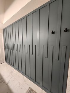 a row of gray lockers in a bathroom