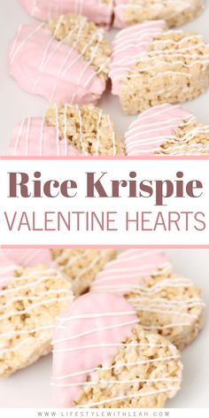 rice krispie valentine hearts with white icing on top and pink frosting in the middle