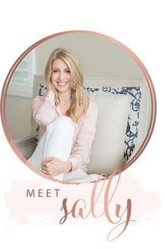 a woman sitting on top of a white couch holding a pillow in her hand and smiling at the camera