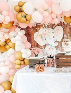 an elephant themed birthday party with balloons and desserts