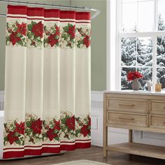 a shower curtain with poinsettis and holly on it in front of a window