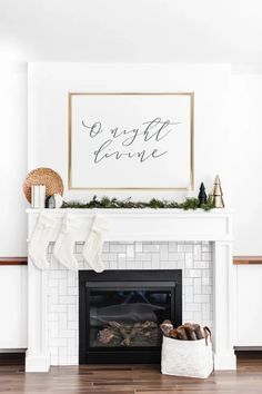 a fireplace decorated for christmas with stockings hanging from the mantel