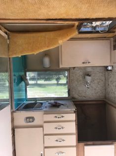 an old camper has been converted into a kitchen