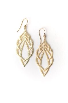 Reminiscent of textured leaves, brushed gold is used in this handcrafted artisan design. They dangle from gold filled ear wires just over two inches. Matte Gold Plated Brass (nickel and lead-safe) 2.25", with gold filled ear wires We hand select our natural materials, thus there may be slight variations in color and/or size that will not detract from the overall aesthetic Our unique handcrafted designer jewelry for women is made in America, each design created individually in our personal design Textured Gold Jewelry For Gifts, Textured Gold Jewelry Gift, Gold Textured Jewelry For Gifts, Gold Teardrop Chandelier Earrings In 14k Gold Filled, Gold Hypoallergenic Teardrop Chandelier Earrings, Gold Teardrop Chandelier Earrings, Elegant Textured Brass Jewelry, Gold Woven Dangle Earrings, Gold Leaf Shaped Metal Jewelry