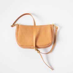 The classic KMM & Co. Crossbody Bag is a perfect everyday companion. Like the other members of the Crossbody Bag family, it's handmade in the USA of beautiful full-grain leather. It comes standard with a solid brass zipper to keep your belongings secure and solid brass D-rings to attach a crossbody or shoulder strap. Choose from a crossbody strap made in the same leather as your bag — like a vintage-inspired chain link strap, a super-adjustable slider strap, or a squishy two-ply strap — or go wi Vegetable Tanned Leather Crossbody Saddle Bag, Daily Use Vegetable Tanned Leather Crossbody Saddle Bag, Vegetable Tanned Leather Crossbody Saddle Bag For Daily Use, Everyday Vegetable Tanned Leather Crossbody Saddle Bag, Daily Use Crossbody Vegetable-tanned Saddle Bag, Vegetable-tanned Saddle Bag For Everyday Use, Crossbody Style, Classic Leather Tote, Leather Crossbody Bags, Custom Strap