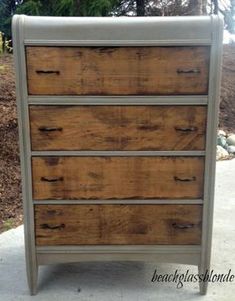 an old dresser is painted white and brown