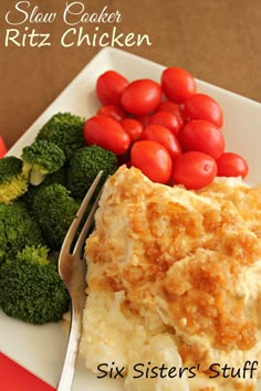 a white plate topped with mashed potatoes and broccoli next to a fork