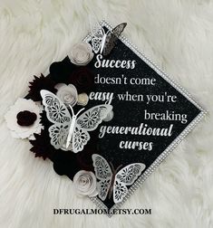 a black and white graduation cap with butterflies on it that says success doesn't come easy when you're breaking generational curves