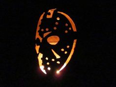 a scary mask is lit up in the dark