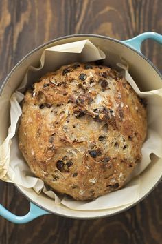 a loaf of bread in a blue pot