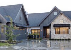 a large house with two garages on each side