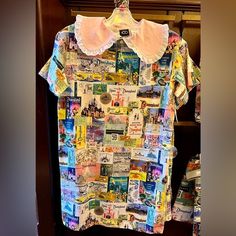 Dress Adult 1X 100th Anniversary Disney100 Disney Eras Disneyland Poster Dress Disney Short Sleeve Dresses With Character Print, Poster Dress, Disneyland Poster, Disneyland Dress, Disney Eras, Disney Dresses, 100th Anniversary, Pink Collars, Dress 100