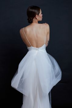 Stunning oversized bow belt in tulle with a silk satin sash. Use it as a fashion statement, as a belt, as a veil, as a shawl! Made to measure with snap closure. Light ivory tulle. Specify waist measurement in 'Notes' section at checkout. Allow 4-5 weeks from placing the order, for production. This is a made to order piece. There will be slight variances from piece to piece due to the nature of handmade items. Photos by Jennifer Cole Rodriguez & Sawyer Baird / Makeup by WINK / Hair by Katie Manselle of Culture Hair Studio / Gowns from Gilded Bridal Tulle Wedding Dress With Bow Tie Back, Elegant Tulle Skirt For Evening, Elegant Tulle Fabric For Wedding Night, Elegant Organza Dress With Satin Bow, Elegant Tulle Dress For Wedding Night, Elegant Wedding Night Dress With Tulle Skirt, Sheer Organza Tulle Fabric For Evening, Elegant Sheer Veil For Evening, Organza Veil For Ceremony