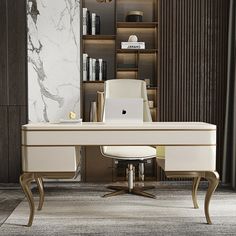 a desk with a laptop on it in front of a bookcase and bookshelf