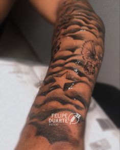 a man's arm covered in water and ink with the words felpe duarte on it