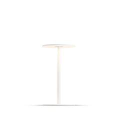 a white table with a round light on it's top and the base is empty