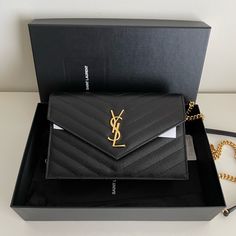 Saint Laurent Cassandre Envelope Chain Wallet In Grain De Poudre Leather Brand New With Original Packaging Includes Dust Bag, Care Cards, Box Black / Gold Hardware Dimensions: 7.5 X 5 X 1.4 In Chain Length: 21.7 In 100% Authentic. Pm Will Handle Authentication. Price Is Firm On This Platform. Offers Will Be Ignored. Thank You For Your Interest! Girly Bags, Chain Wallet, Saint Laurent Bag, Wallet Chain, Chain Lengths, Chain Length, Gold Hardware, Saint Laurent, Grain