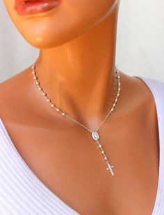 "This is a beautiful high quality, completely 14kt gold filled rosary inspired necklace! This gorgeous necklace features a 12x8mm oval Miraculous center medallion, 3.5mm gold filled round beads, 10 on each side. Drop measures 2.25\" with 3 beads and a 16x10mm gold filled cross pendant. Necklace is adjustable 15\" to 18\" length. Can be worn as a choker or a necklace. A spring clasp closure sits at back with the adjustable length. You can view the entire necklace up close if you scroll though all Scapular Rosary Cord Necklace, Rosary Choker, Catholic Jewelry Necklace, Rosary Inspired Necklace, Cross Pendant Necklace Woman, Gold Rosary Necklace, 14kt Gold Jewelry, Silver Rosary, Gold Rosary