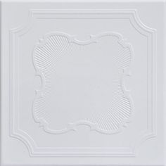 a white ceiling tile with an intricate design on the top and bottom half of it