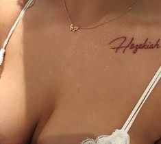 a close up of a woman's chest with the word hager written on it