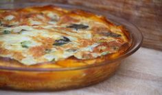 a casserole dish sitting on top of a wooden table