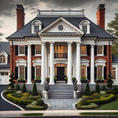 a large house with columns and pillars on the front