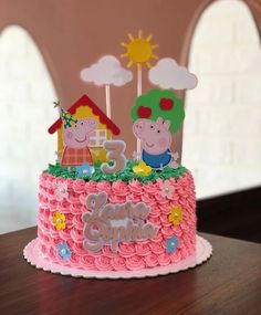 a peppa pig birthday cake on a table