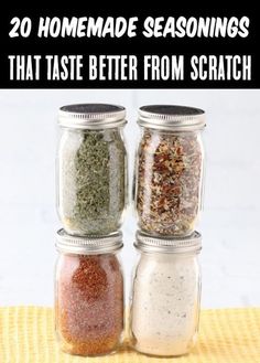 three jars filled with different types of seasonings on top of a yellow cloth next to each other