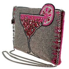 Mary Frances Pink Martini Crossbody Clutch Beaded Drink Handbag Bag New Enjoy this cocktail-y affair with this stunning pink martini-themed crossbody handbag. The martini design is accented with shimmering rhinestones, giving this bag a touch of sassy glamour. This multi-functional accessory can be used as a traditional clutch for a night out, or as a crossbody bag for a hands-free option. So sparkle like never before and stay Cool, Calm, Cocktailed! 9.25 x 1 x 6", Total Height with fruit slice: Pink Beaded Shoulder Bag For Party, Pink Beaded Party Shoulder Bag, Pink Embellished Shoulder Bag For Party, Pink Embellished Clutch Bag, Embellished Pink Evening Bags, Evening Embellished Pink Bags, Embellished Pink Clutch Evening Bag, Pink Beaded Clutch Shoulder Bag, Pink Beaded Clutch Evening Bag