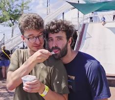 two young men taking a selfie with an ice cream cone