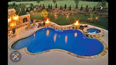 an outdoor swimming pool surrounded by patio furniture and fire pit with seating area next to it