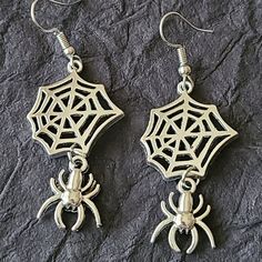 Spider Earrings- Halloween Earrings-Animal Earrings-Fashion Earrings Material: Alloy Diameter: 6.2 Cm Long X 2 Cm Wide New Without Tag Elegant Metal Halloween Earrings, Elegant Metal Earrings For Halloween, Halloween Dangle Metal Earrings, Metal Dangle Earrings For Halloween, Silver Witchy Earrings For Party, Punk Halloween Party Earrings, Silver Witchy Party Earrings, Halloween Party Single Earring Jewelry, Single Earring For Halloween Party