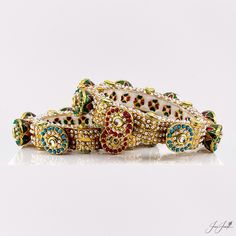 Size:2.6 Enhance your special day with our multi-color meenakari pearls pacheli openable wedding bangles. These bangles feature stunning multicolored meenakari and delicate pearls, making them the perfect accessory for your wedding. Elevate your traditional look with the vibrant colors and intricate design of these bangles. Multicolor Meenakari Bracelets For Party, Luxury Traditional Meenakari Bangle, Ornate Meenakari Bangle For Wedding, Ornate Meenakari Wedding Bangle, Traditional Meenakari Gold-plated Bangle, Round Rock, Size 2, Bangle Bracelets, Multi Color