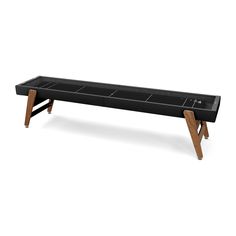 a black bench with two wooden legs and an open drawer on the bottom, in front of a white background