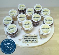 there are many cupcakes on the plate with congratulations written on them for someone's special occasion