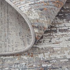 a close up view of the area rugs with different colors and patterns on them