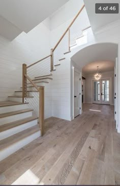 an open floor plan with stairs leading up to the second story