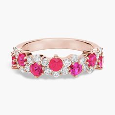 14k rose gold enhances the fiery glow of these round rubies as they emanate from a delicate garland of diamonds that weaves around in an elegant curving line giving this ring a romantic contemporary look. Ruby And Diamond Ring, Christmas Cookies Decorated, Cookies Decorated, Blue Nile, Ruby Ring, Precious Gemstones, A Romantic, Christmas Cookies, Fashion Rings