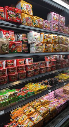 a display case in a store filled with lots of different types of food and snacks